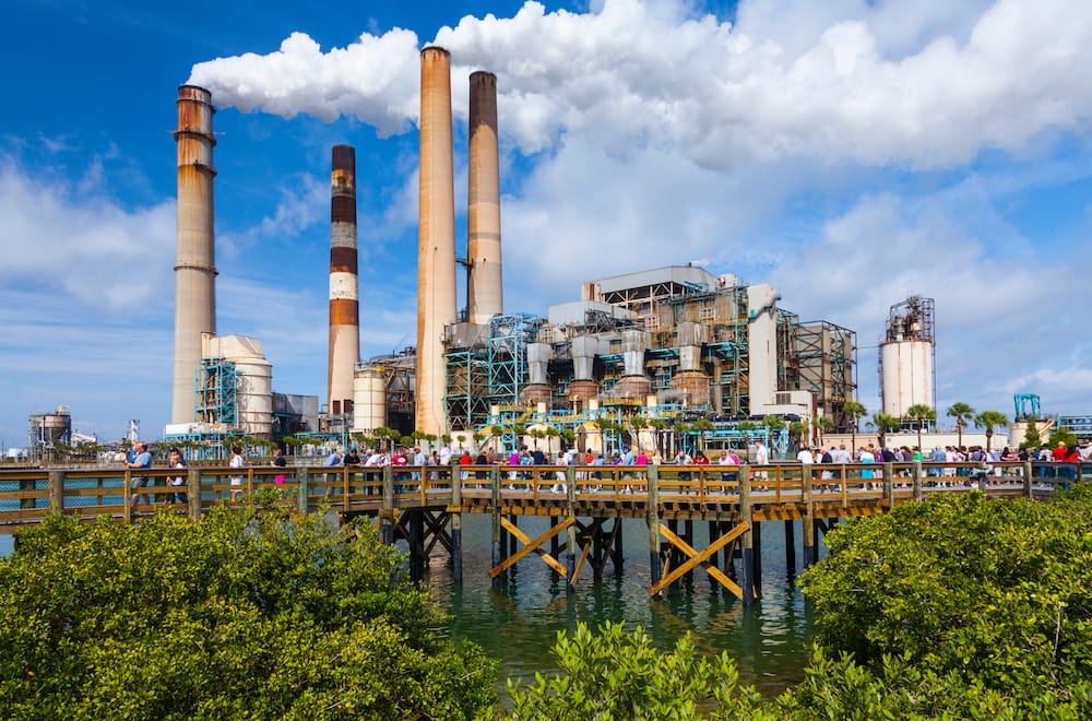 The Manatee Viewing Center in Tampa in front of a large power plant, one of the best cheap things to do in Tampa Bay