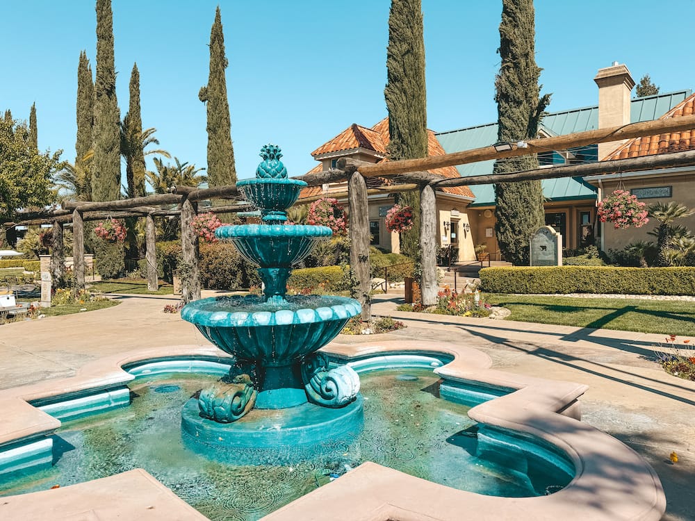 A turquoise fountain in front of South Coast Winery in Temecula.