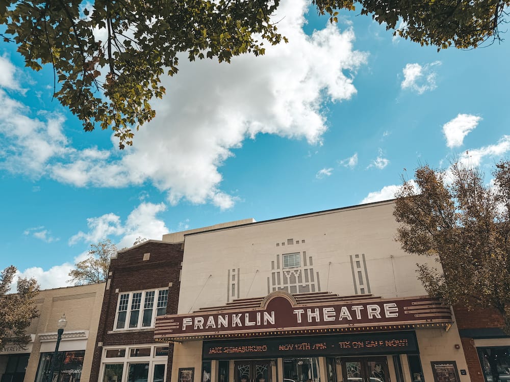 The red and brick exterior of the Franklin Theatre, one of the best things to do in Downtown Franklin