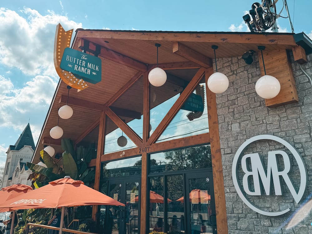 The stone and wood exterior of The Butter Milk Ranch in 12 South