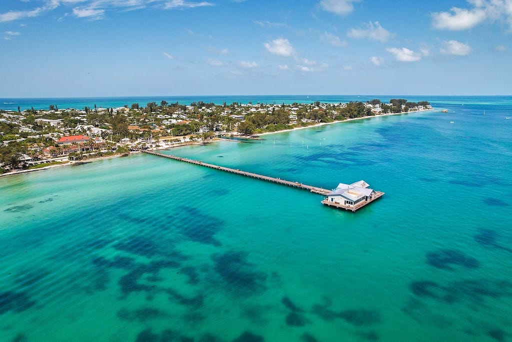 A long boardwalk in a bright blue ocean at Anna Maria Island.