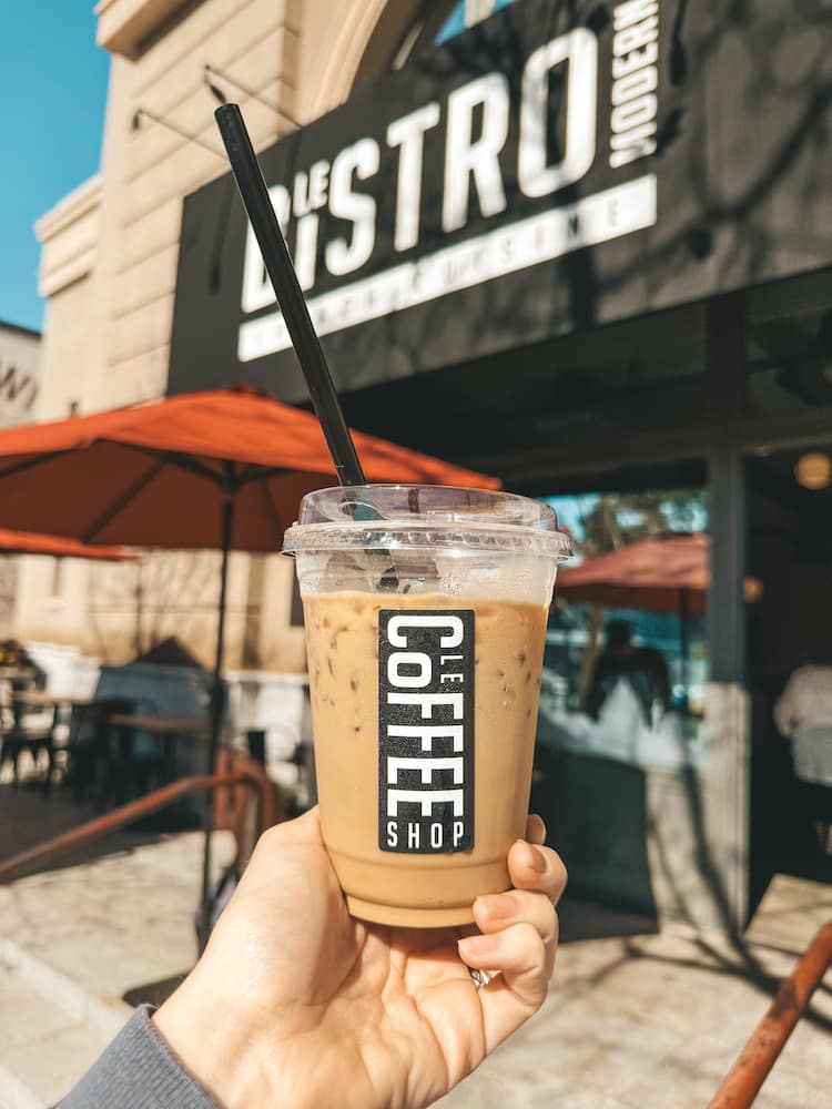 An iced coffee from Le Coffee Shop in Old Town Temecula in front of the porch