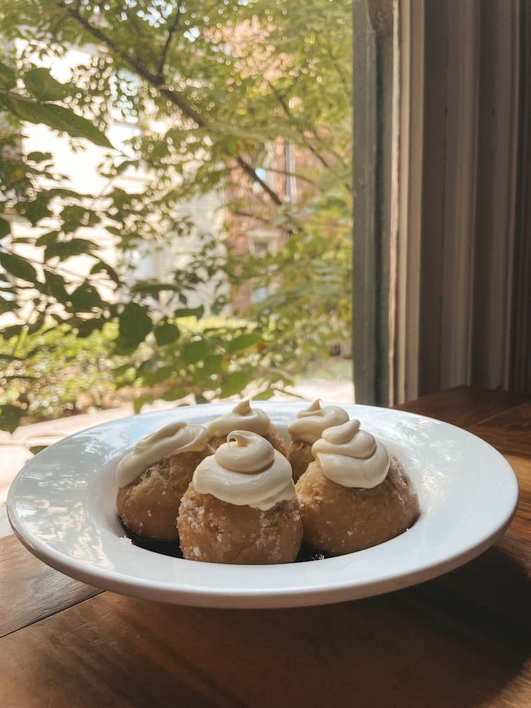 A plate of donuts made from biscuit dough sitting on a table at Biscuit Love, one of the best places to eat in Nashville.