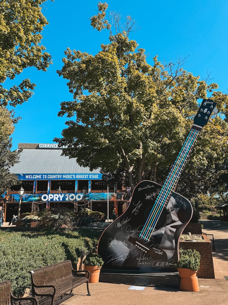 The outside of the Grand Ole Opry and the larger-than-life guitar that sits near the entrance