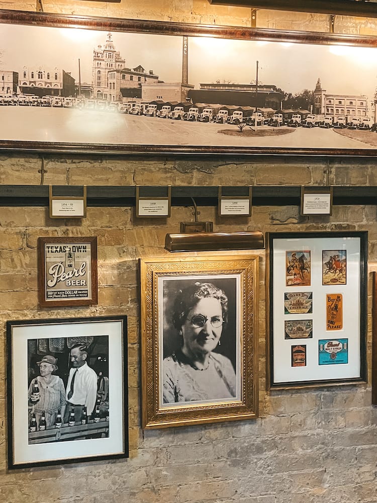 A timeline of Hotel Emma showcasing a photo of Emma Koehler from the 1900s and other memorabilia and artifacts from the Pearl Brewery in San Antonio.