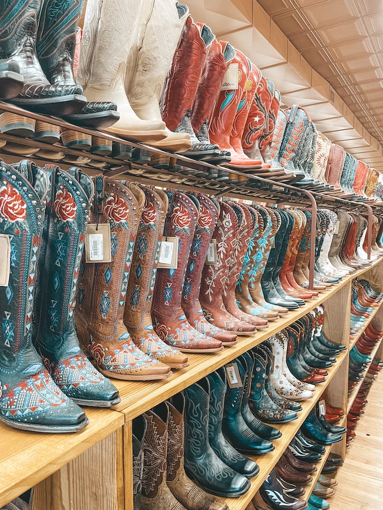 Several shelves of cowboy boots at Allens Boots in Fredericksburg, TX.