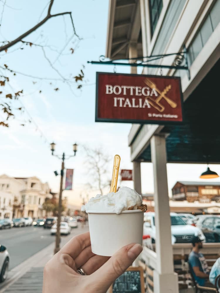 A cup of gelato in front of the sign for Bottega Italia in Old Town Temecula