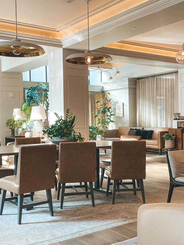 This inside of a coffee shop with lots of greenery