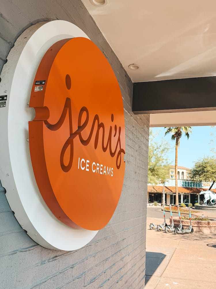 An orange sign that says "Jeni's Ice Creams" in Old Town Scottsdale