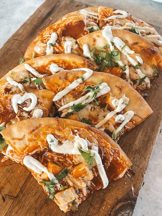 A buffalo chicken flatbread on a wooden board at a gastropub in Old Town Temecula.