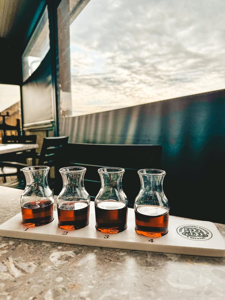 A flight of four red wineries at Three Brothers Winery in the Finger Lakes
