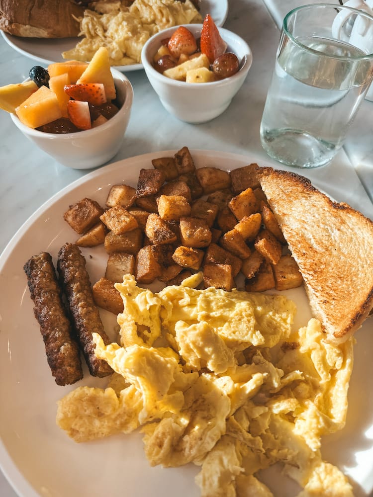 A breakfast spread with toast, potatoes, sausage, and eggs at the Finger Lakes