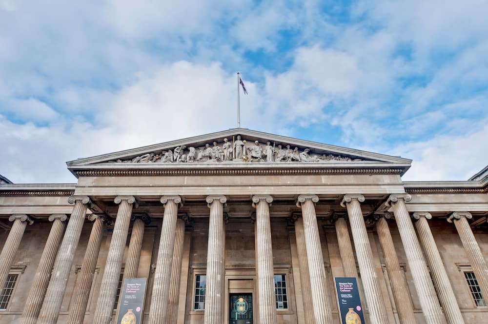 The exterior and main entrance of The British Museum with stone pillars – one of the best cheap things to do in London