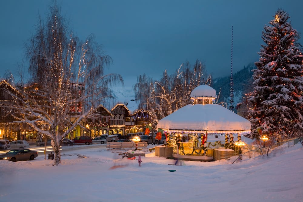 The snowy town of Leavenworth in Washington - one of the best places to visit in the USA in December - all decked out in lights for the holidays.