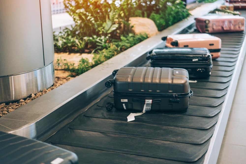 Several suitcase or luggage with conveyor belt in the international airport: what to do if your luggage is lost