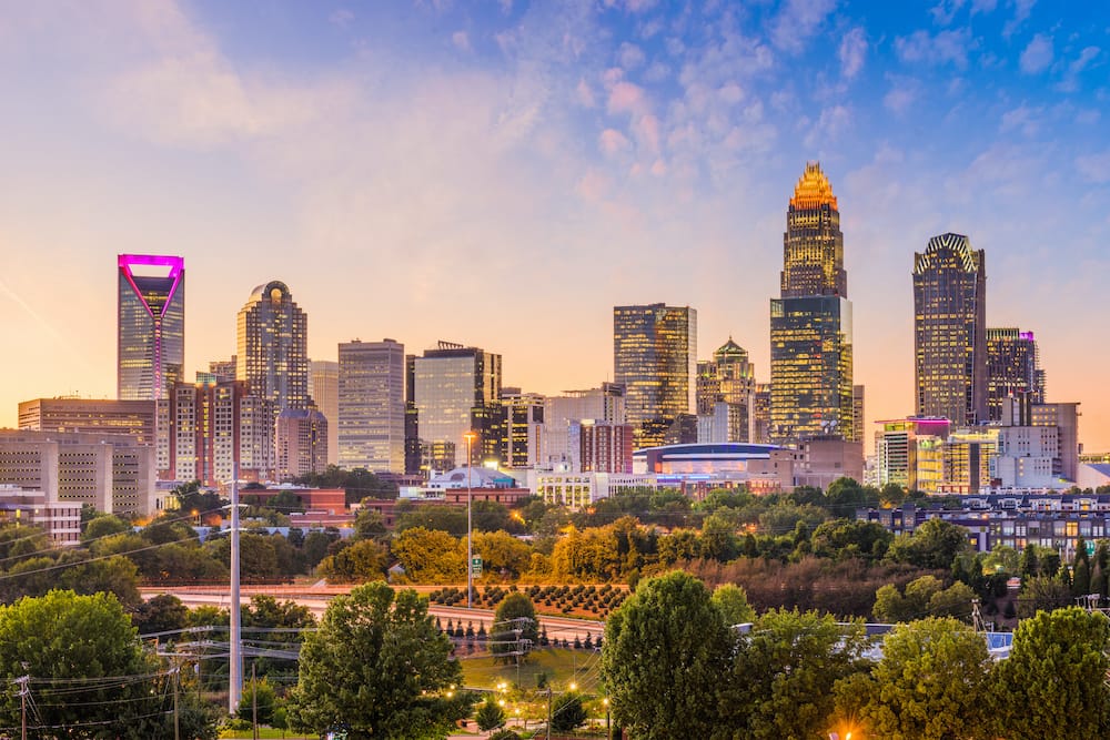 A sparkling city skyline at sunset In Charlotte, North Carolina.