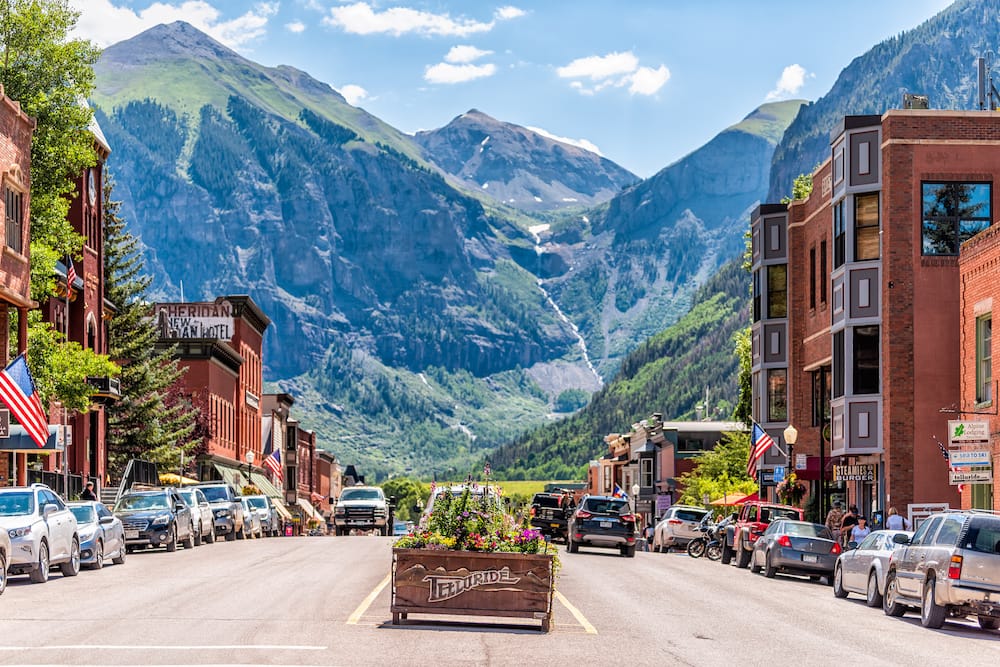 The quaint mountain town of Telluride the beautiful mountains in the distance.