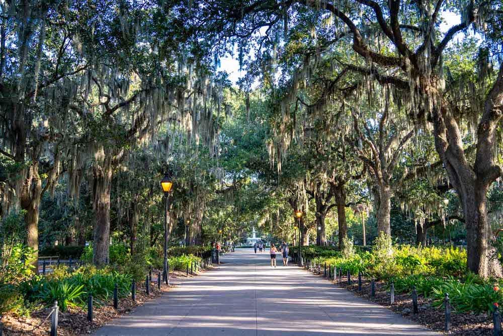 A view of the mossy oaks and lanterns lining a pathway in Forsyth Park in Savannah, Georgia, in October.