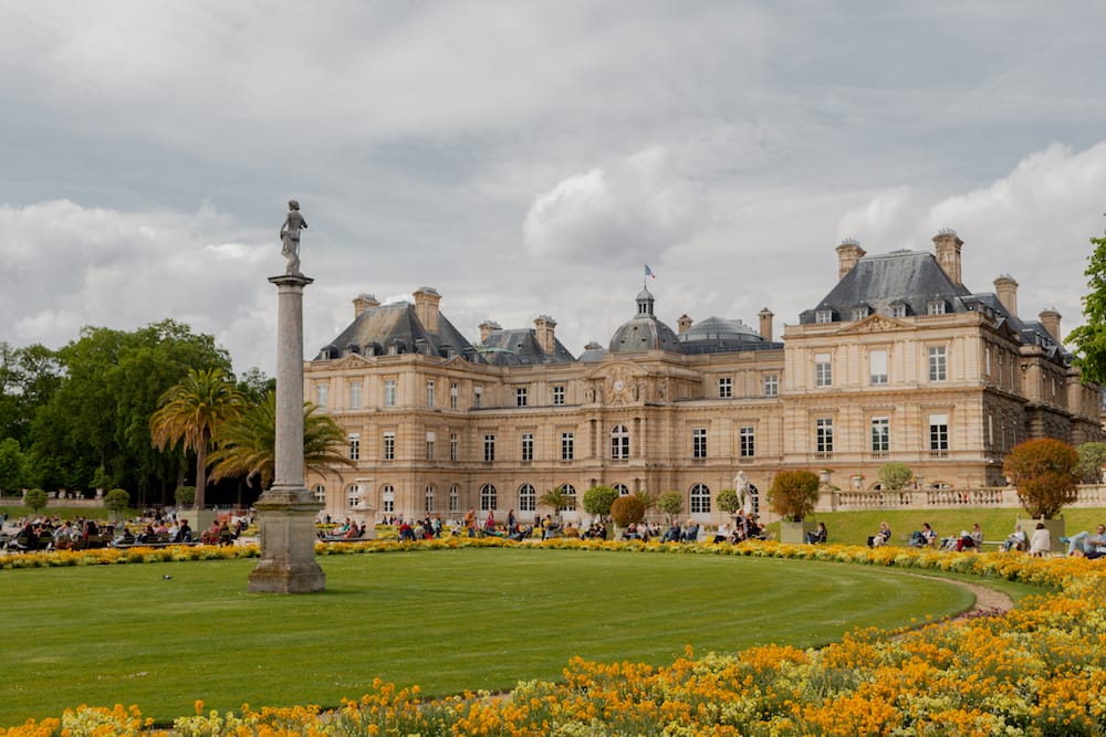 The gorgeous yellow flowers and green grass in the Jardin du Luxembourg, one of the prettiest parks in Paris.