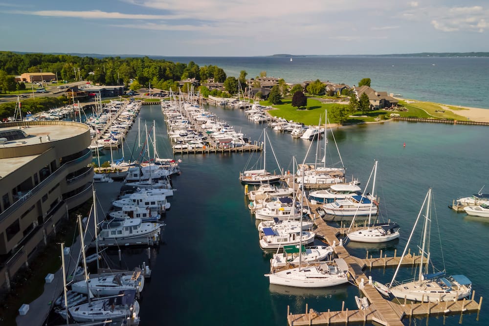 Several sailboats docked in a harbor in Traverse City, Michigan, one of the best places to visit in the USA in July.