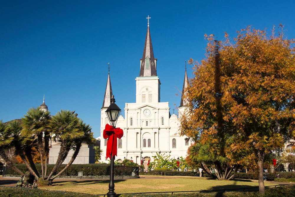 Jackson Square in New Orleans is decorated with red bows for December.