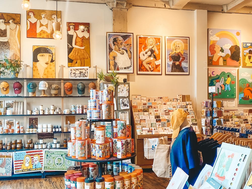 A boutique store filled with artwork, hats, cards, and other handmade items