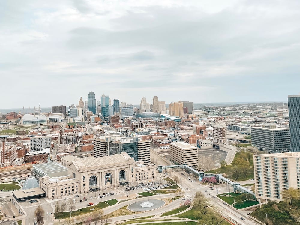 Kansas City from above, featuring Union Station, a park, and other skyscrapers and hotels against the skyline