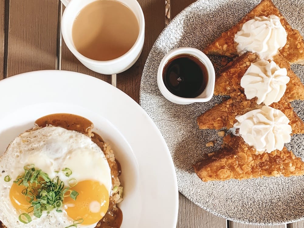 Two plates with French toast and an egg dish from Basalt, a great place to eat in Waikiki.