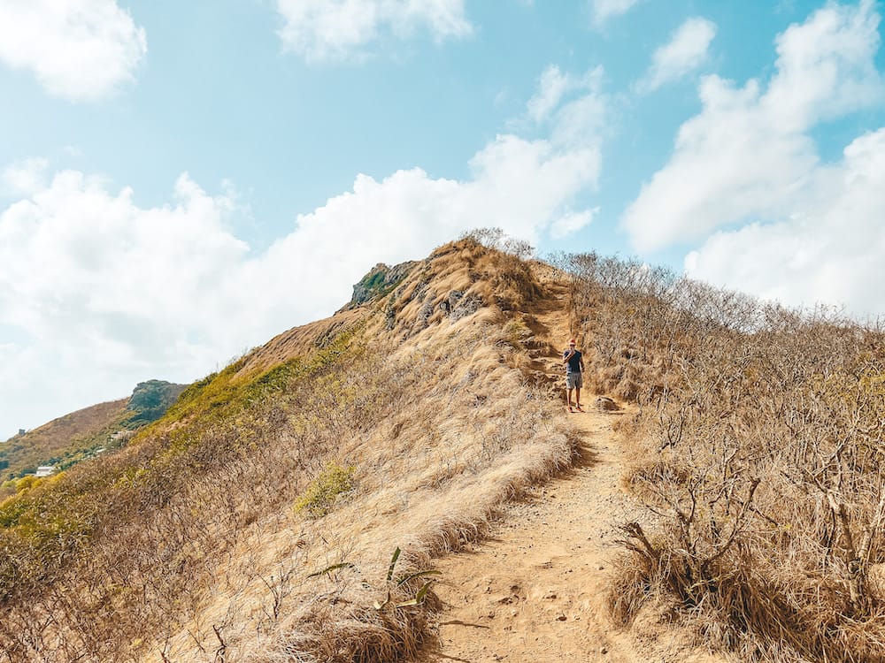 A view from the bottom of the Lanikai Pillbox Trail looking up the steep, dirt path of the mountain.