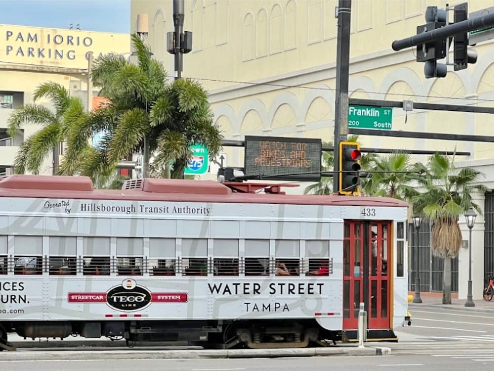 The red and white TECO Streetcar on Franklin Street in Tampa Bay, one of the best cheap things to do in Tampa