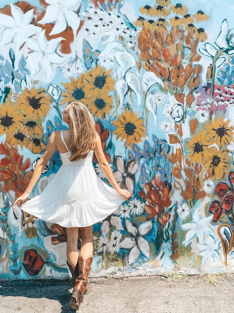 Mural with tons of colorful flowers, including sunflowers, in Nashville