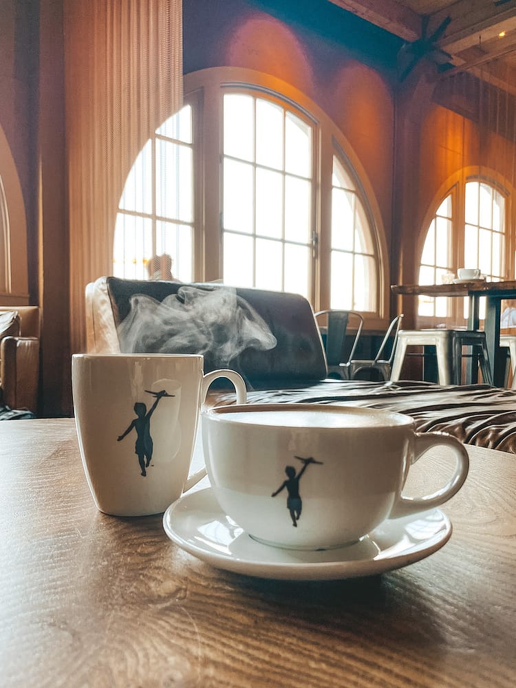 Two steaming cups of coffee in Storyville Coffee in Seattle, WA