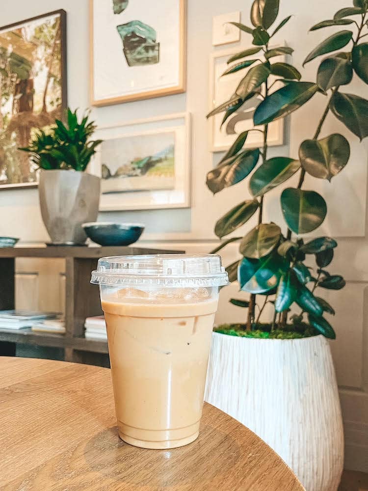 A cup of coffee from a coffee shop  in Portland, Oregon sitting on a table