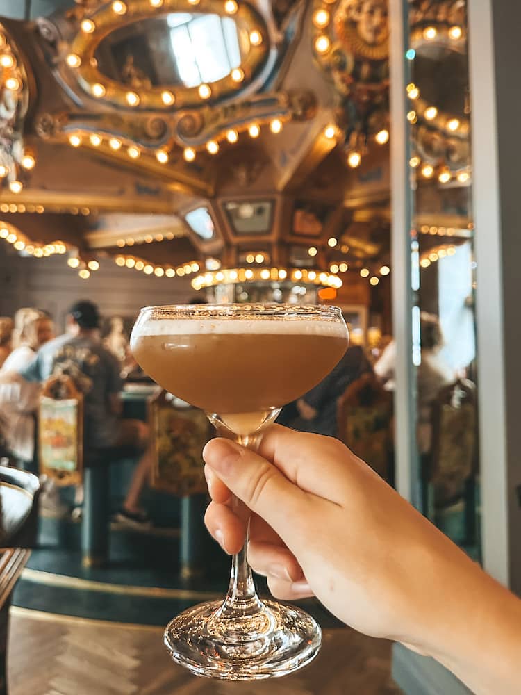 A drink in front of a carousel at the Carousel Bar, one of the best things to do during a weekend in New Orleans