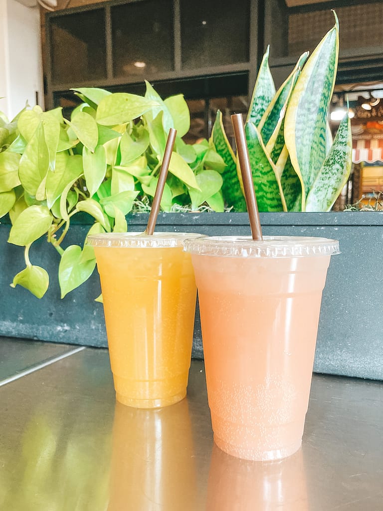 Two ginger beers, one orange and one pink, that you can enjoy on one of the best Pike Place Market food tours in Seattle.