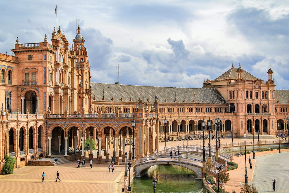 The ornate and historic buildings in Plaza de España, one of the top tourist attractions in Seville and best places to visit in Spain in spring